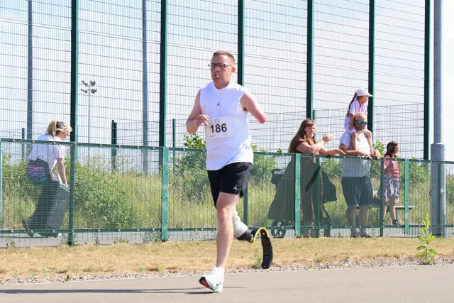 Simon running a race on a running blade